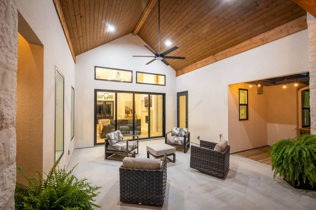 Covered outdoor living area with wood ceiling at the 8179 Blue Oak Way custom home