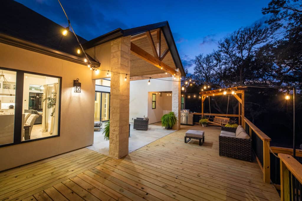 Covered patio with string lights and pergola at the 8179 Blue Oak Way custom home