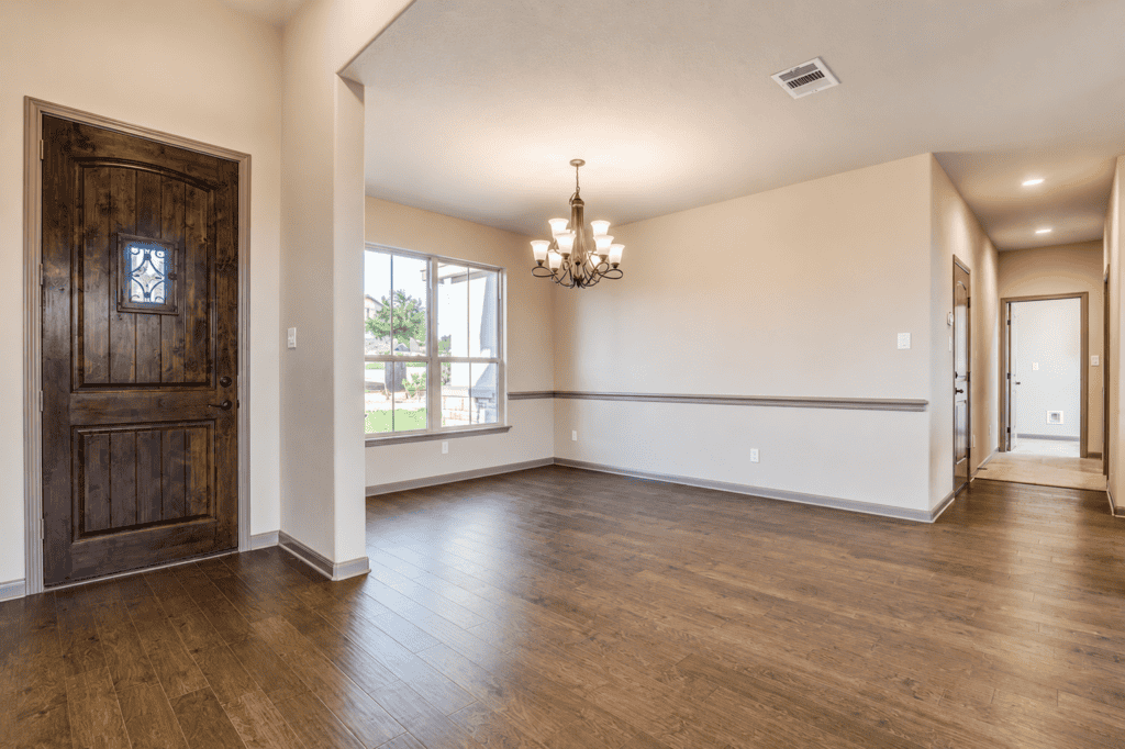 Entry and dining area with wood front door in the 1115 Barolo Court custom home