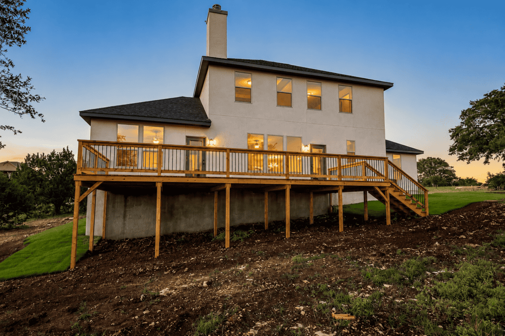 Rear exterior with elevated wood deck at the 1115 Barolo Court custom home